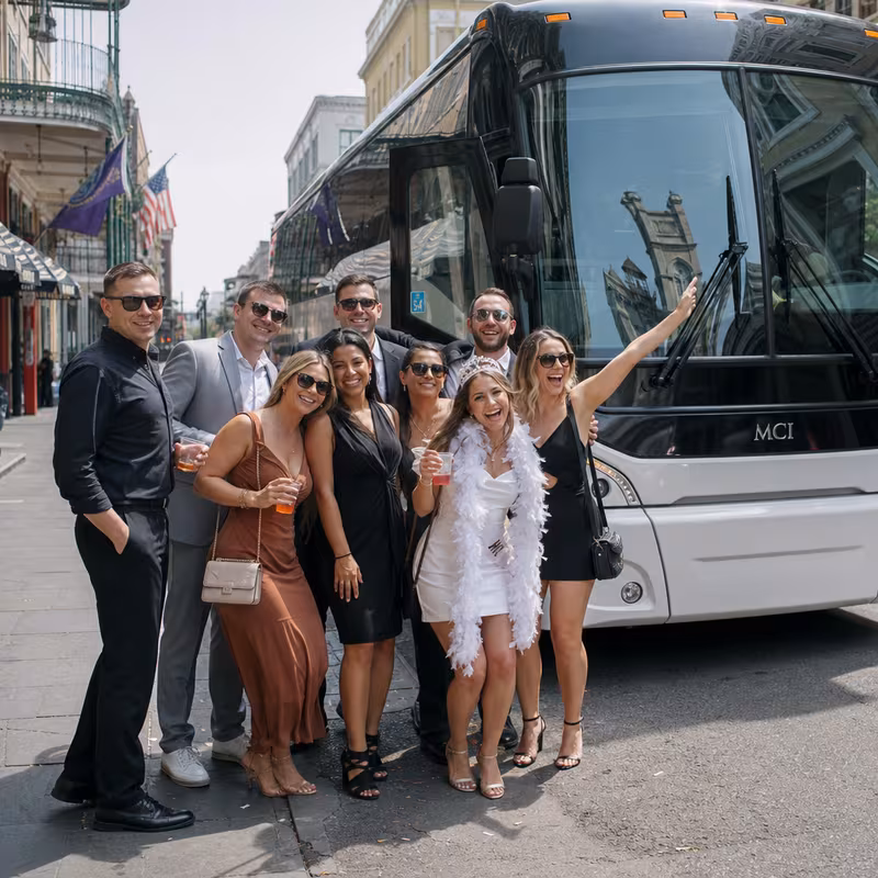Passengers loading luggage while boarding an New Orleans group shuttle