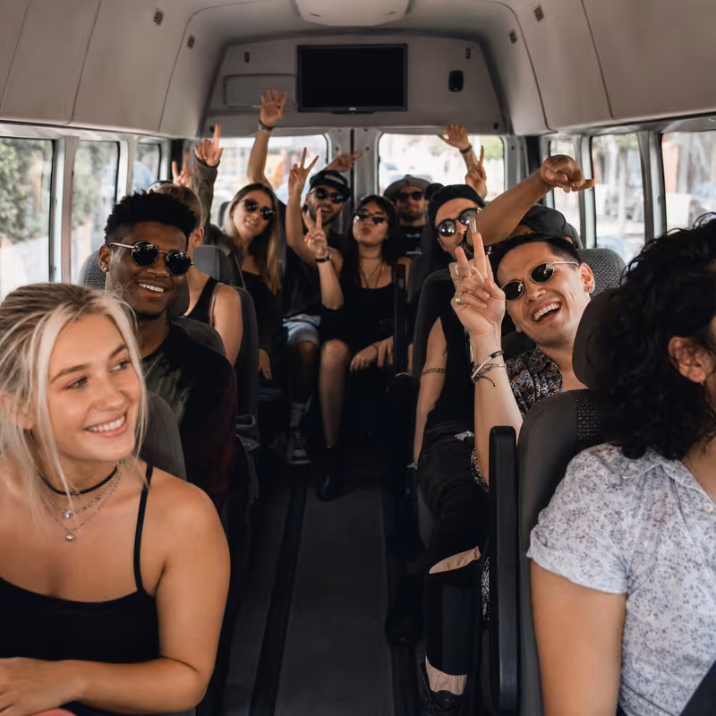 Party bus interior with wraparound leather seating and LED lighting in New Orleans