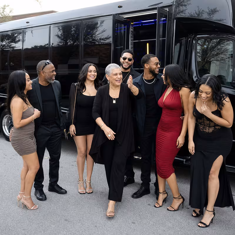 Passengers loading luggage while boarding an New Orleans group shuttle