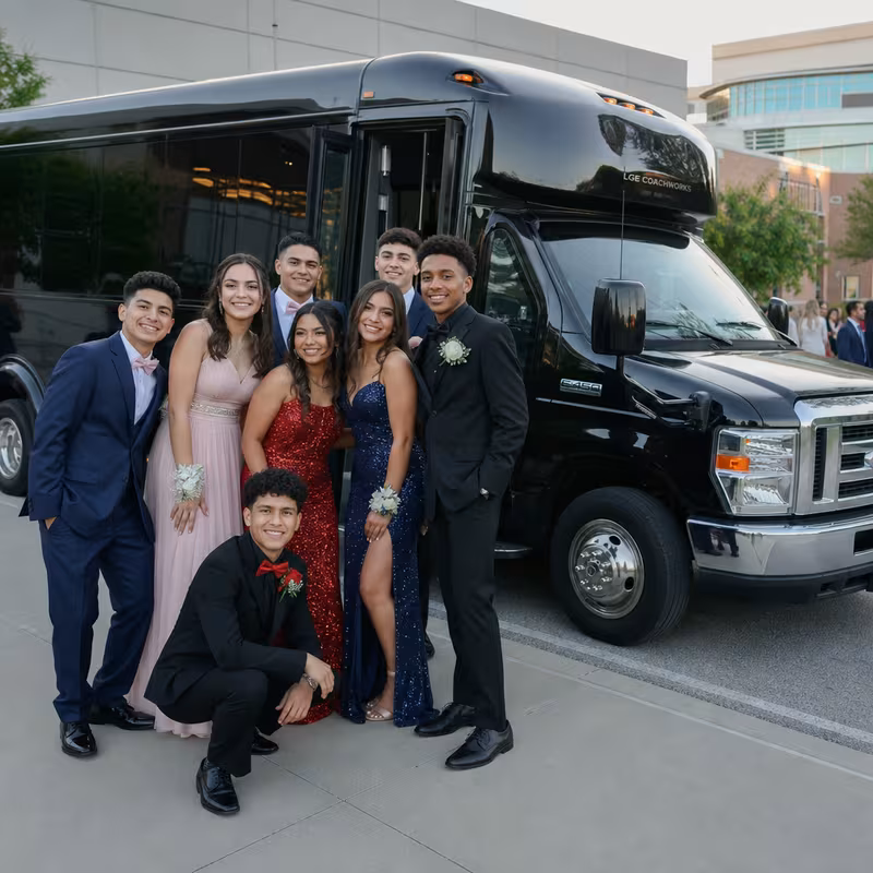 Group boarding a white charter bus for Prom & Homecoming Transportation transportation in New Orleans