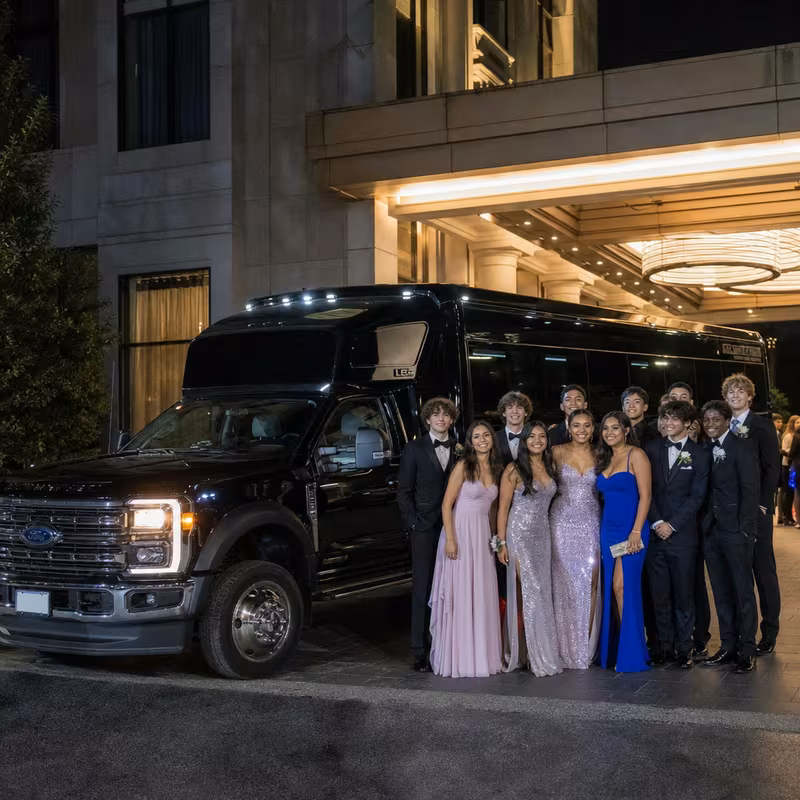 Party bus interior with wraparound leather seating and LED lighting in New Orleans